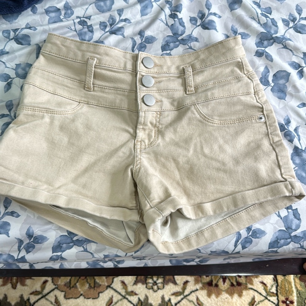 A pair of cream shorts